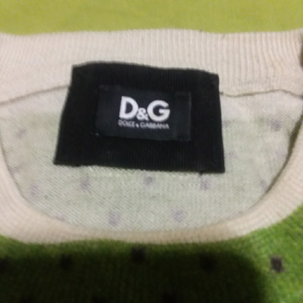 A green, gray and White patterned crewneck sweater